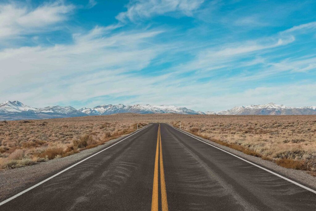 gray-concrete-road-under-blue-sky