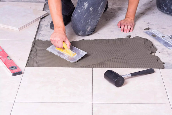 a-man-applying-tile-adhesive