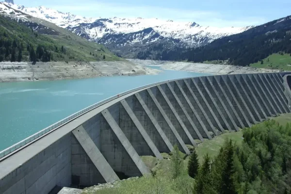 gray dam and blue water